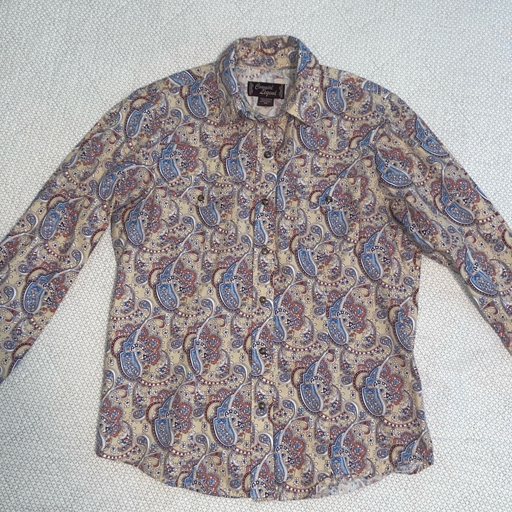 Women’s medium Cowgirl Legend, pearl snap long sleeve shirt.
